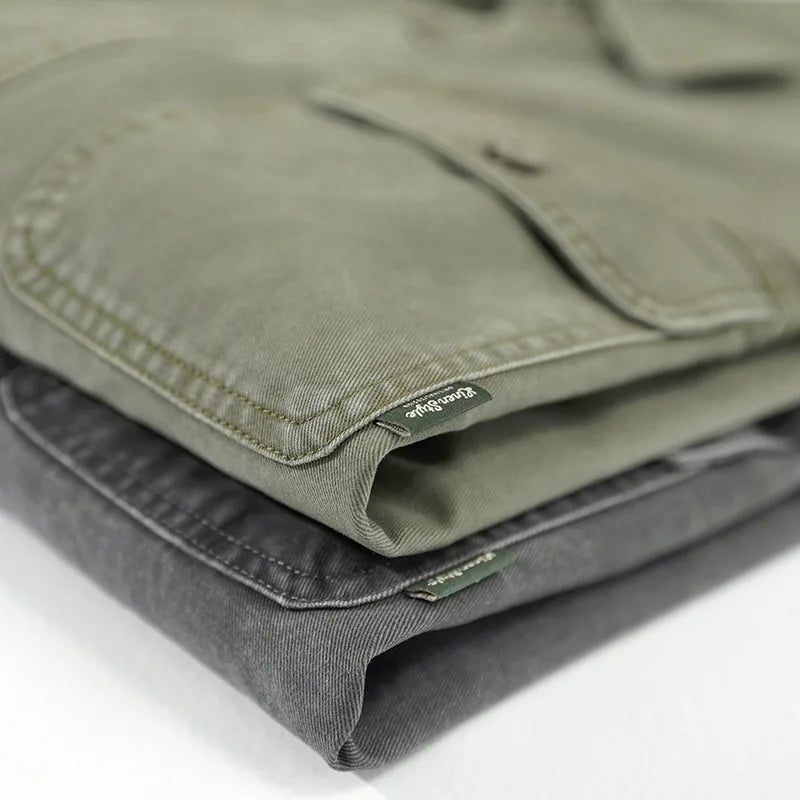 Washed cotton overshirt with double chest flap pockets and detailed topstitching. 