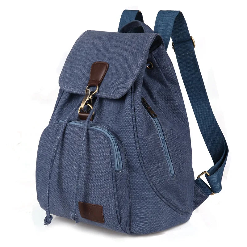 Denim blue Large capacity backpack made from durable canvas material and lined with smooth polyester, with interior pockets.