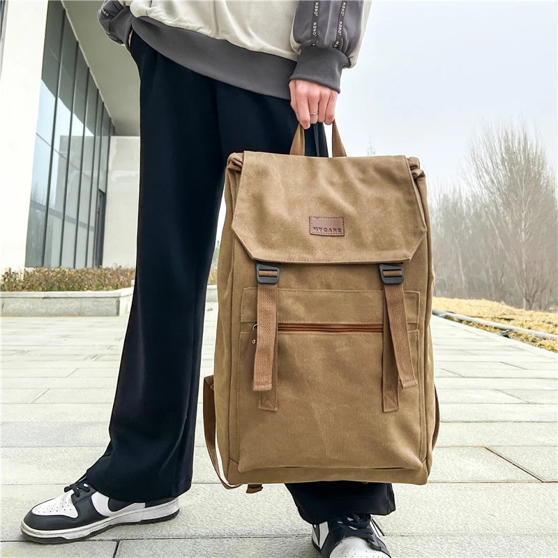 Tan colour Large canvas backpack with outside zip pocket and double clip closure