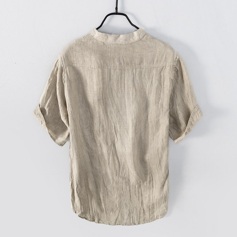 Natural colour Shirt with relaxed fit and short sleeves  with Round stand-up collar V-neck front opening .