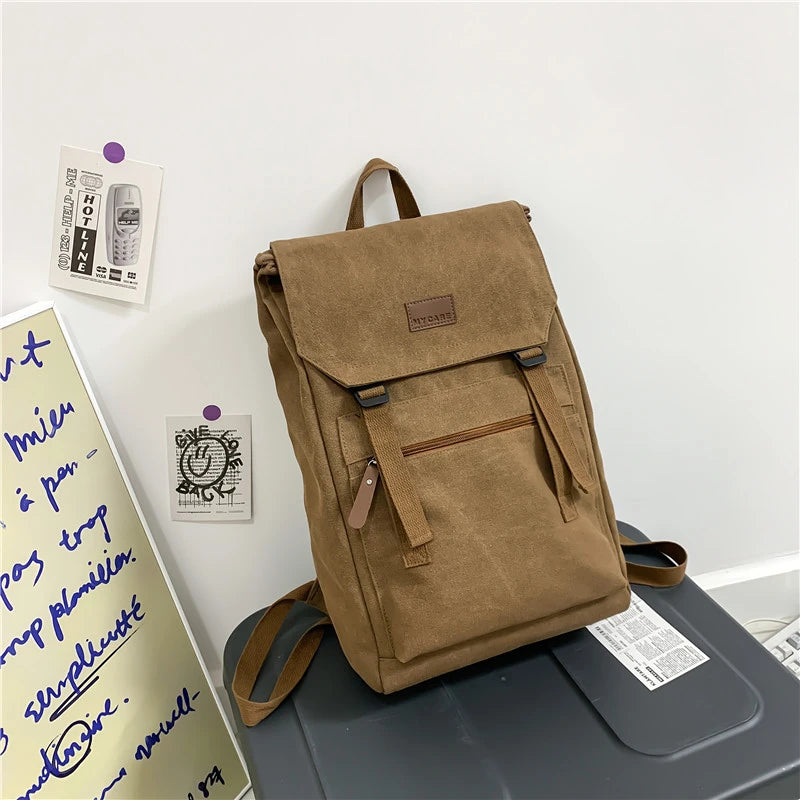 Tan colour Large canvas backpack with outside zip pocket and double clip closure