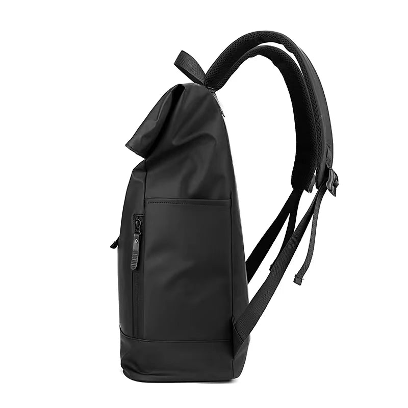 The side of a Black expandable nytlon backpack with zip pockets outside