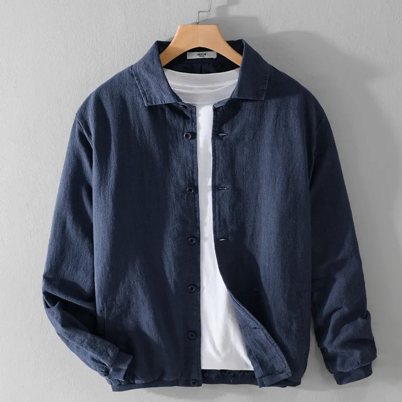 Blue button up jacket worn over a t-shirt