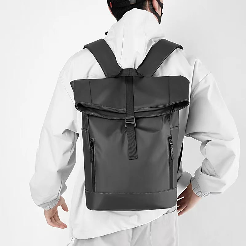 Grey expandable nytlon backpack with zip pockets outside