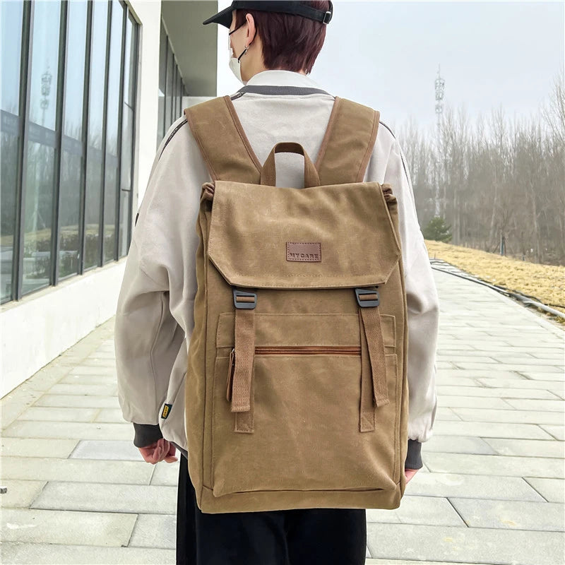 Tan colour Large canvas backpack with outside zip pocket and double clip closure