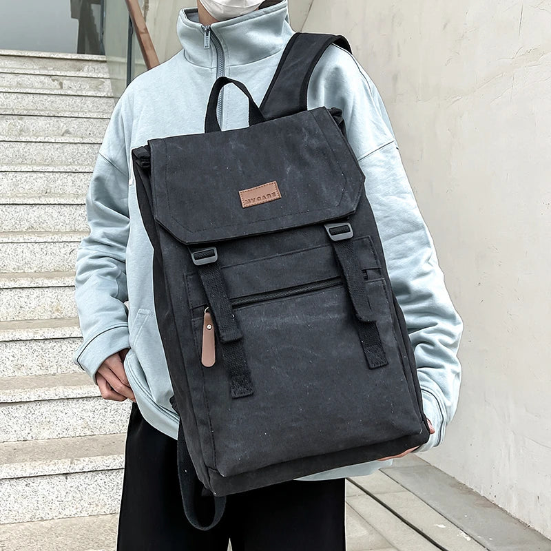 Black  colour Large canvas backpack with outside zip pocket and double clip closure