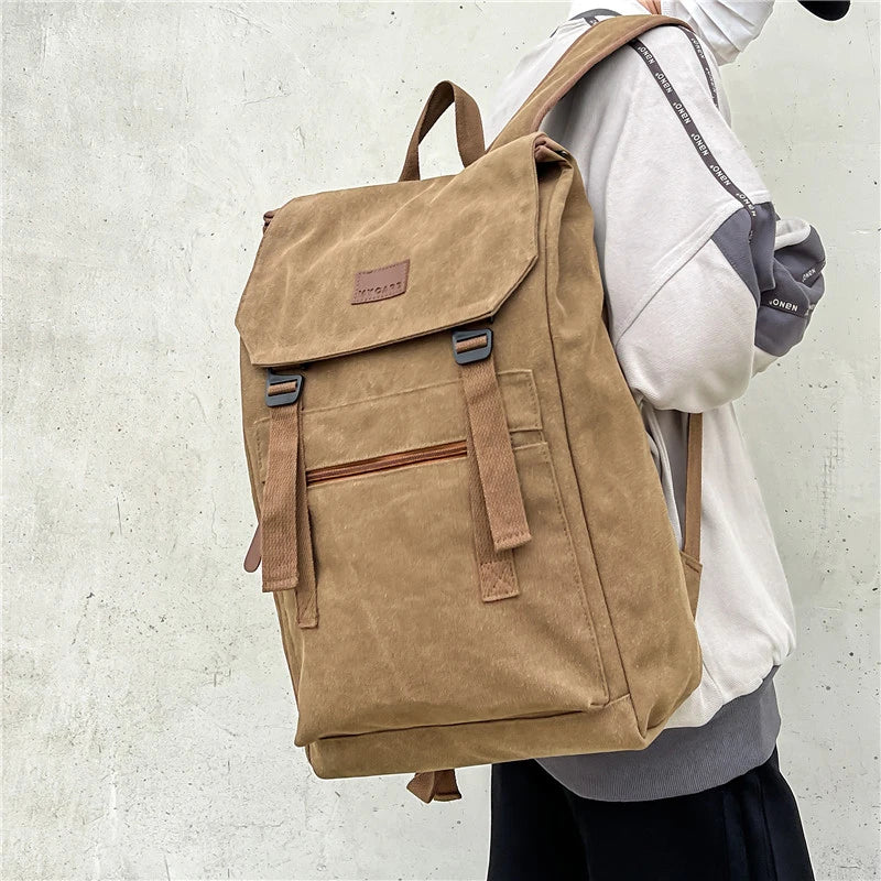 Tan colour Large canvas backpack with outside zip pocket and double clip closure