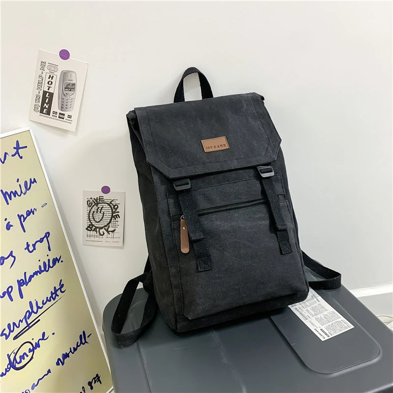 Black  colour Large canvas backpack with outside zip pocket and double clip closure