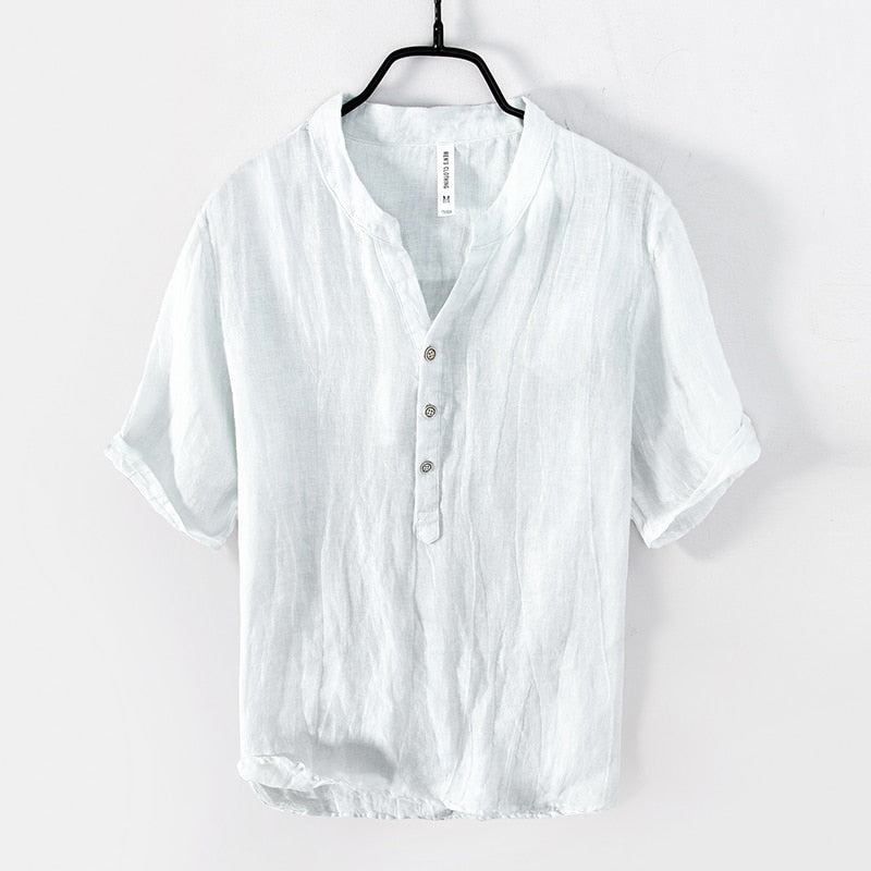 White Shirt with relaxed fit and short sleeves  with Round stand-up collar V-neck front opening .