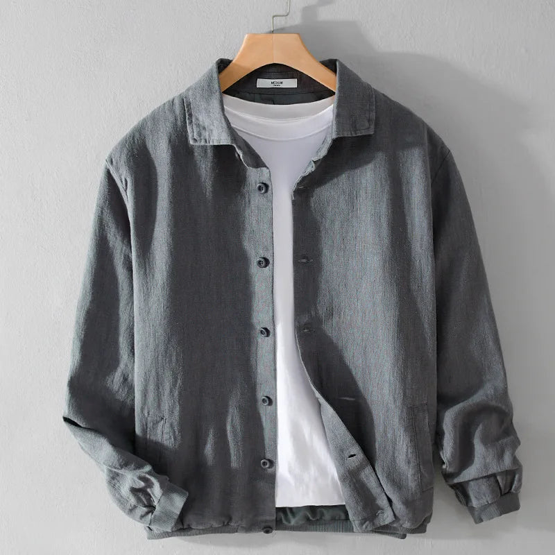 grey button up jacket worn over a t-shirt