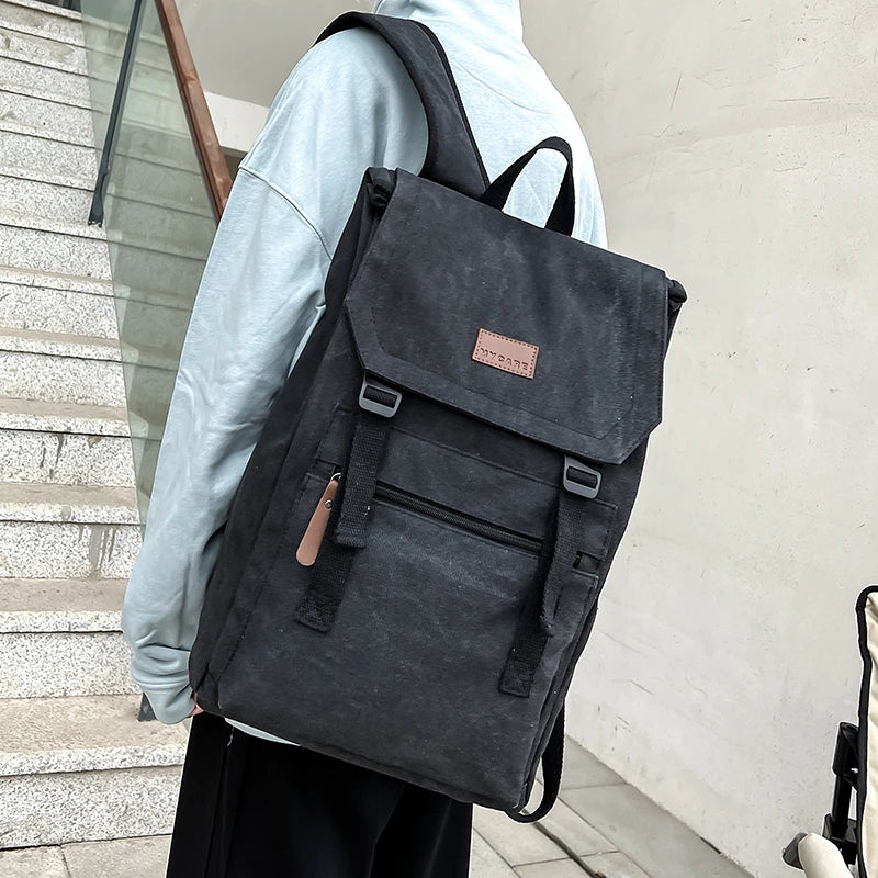 Black  colour Large canvas backpack with outside zip pocket and double clip closure