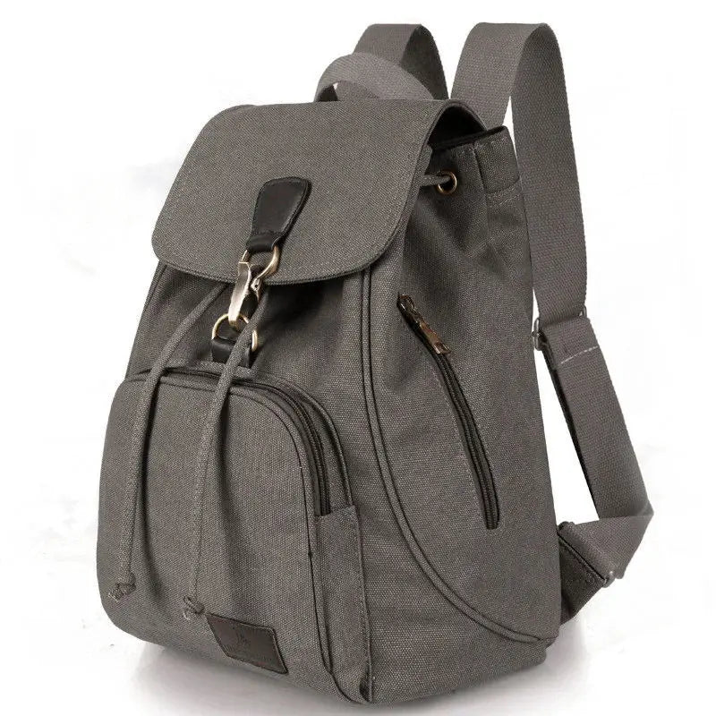 Grey Large capacity backpack made from durable canvas material and lined with smooth polyester, with interior pockets.