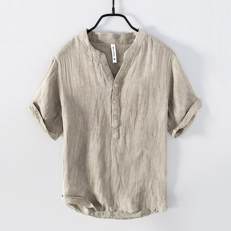 Natural colour Shirt with relaxed fit and short sleeves  with Round stand-up collar V-neck front opening .