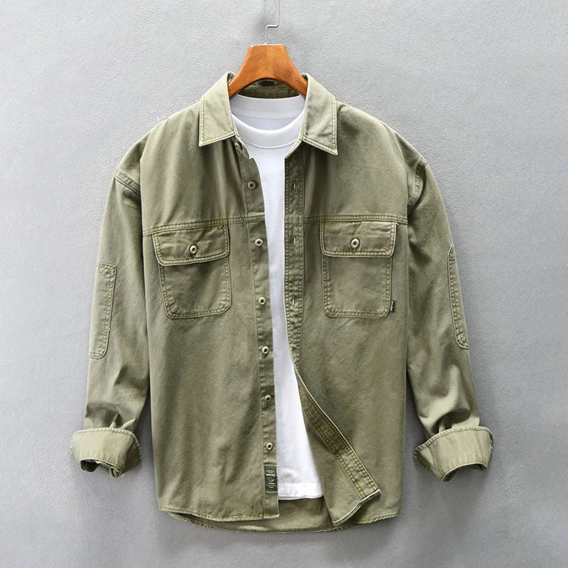 Green Washed cotton overshirt with double chest flap pockets and detailed topstitching. 