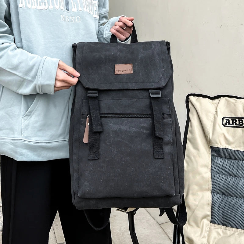 Black  colour Large canvas backpack with outside zip pocket and double clip closure