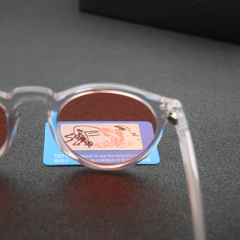 Classic sunglasses with oval plastic pink lenses.